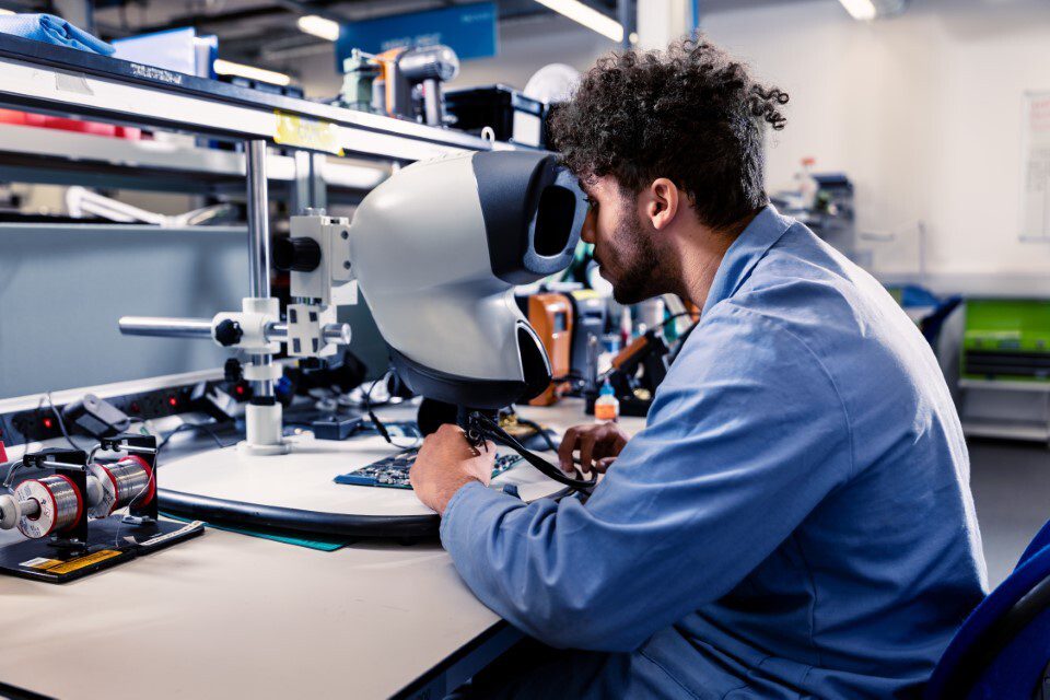 Ontic engineer inspecting a component