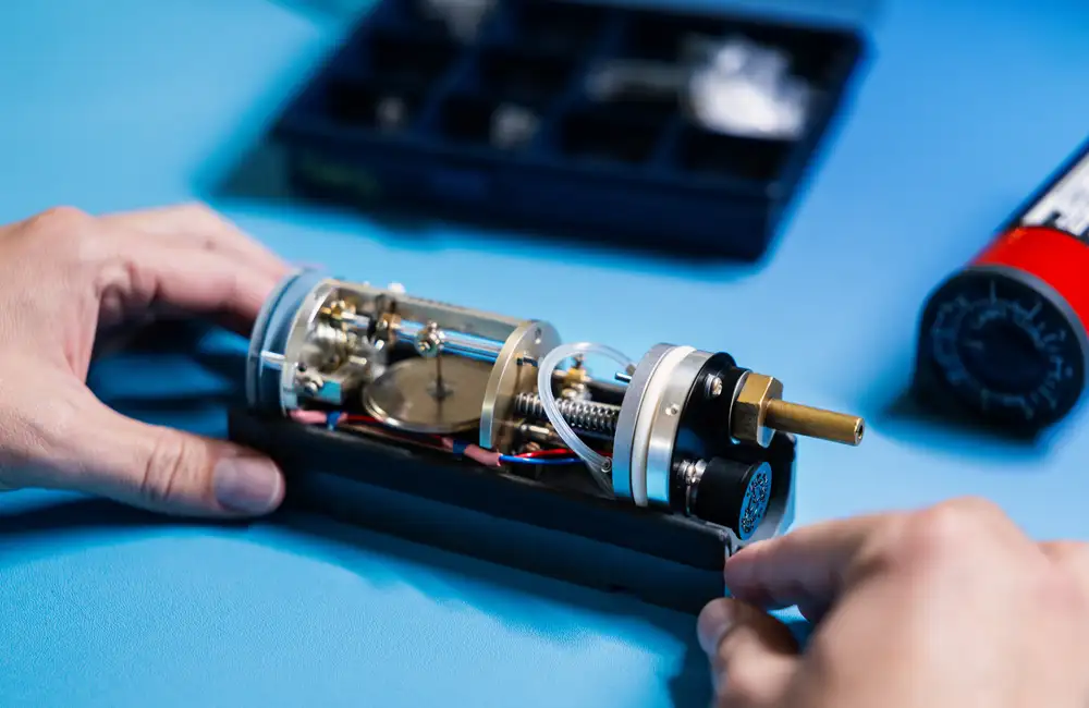 Technician working on rate of climb indicator